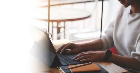 woman typing on computer